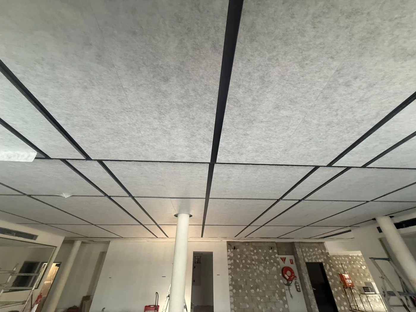 Acoustic ceiling install stage — panels and grid